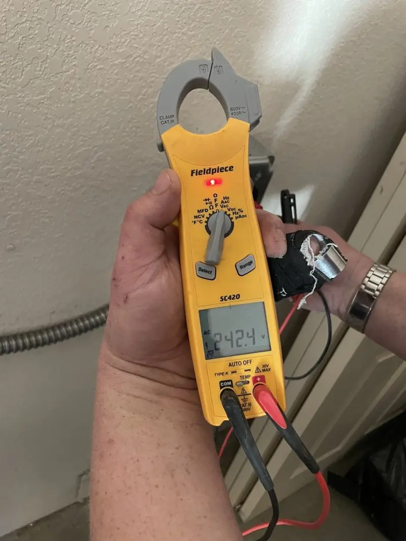 Voltage testing with clamp meter during Electrical Installation Services in Sun Prairie